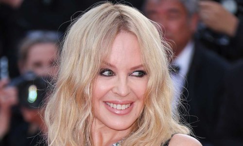 Kylie Minogue stuns in white feathered sequin dress to mark special occasion