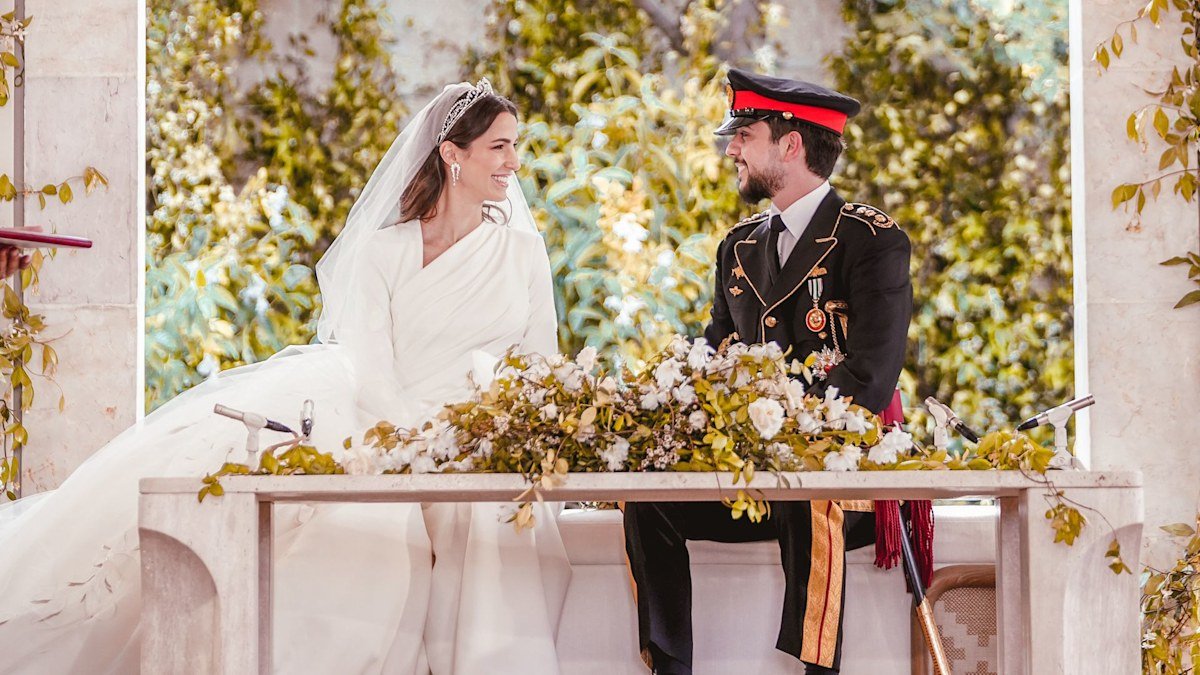 Crown Prince Hussein's resplendent bride Rajwa models fitted wedding dress and shock shoe choice