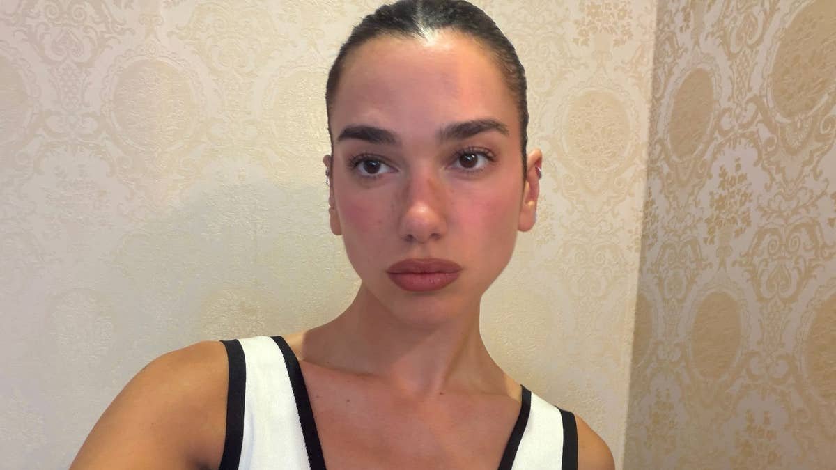 Dua Lipa shows off mesmerizing figure in plunging dress