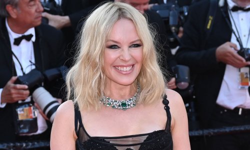 Kylie Minogue sizzles in striking silver dress to announce exciting news