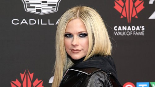 Avril Lavigne stuns in asymmetrical mini skirt with the tiniest appearance change you might've missed as she reunites with ex-husband