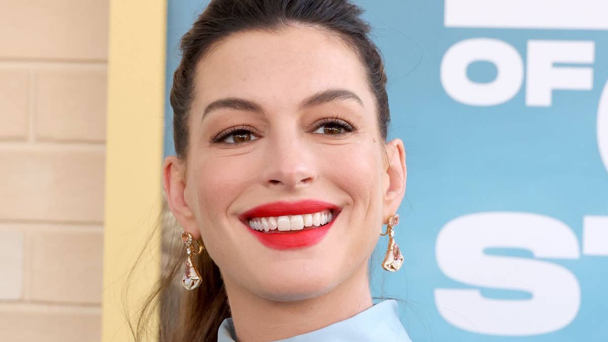 Pregnant Anne Hathaway bares growing baby bump after surprise third pregnancy confession