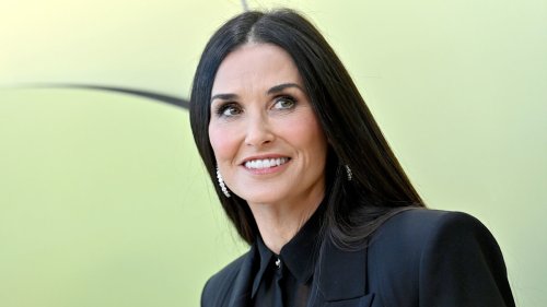 Demi Moore, 61, is a vision in angelic corseted dress with waist-skimming hair