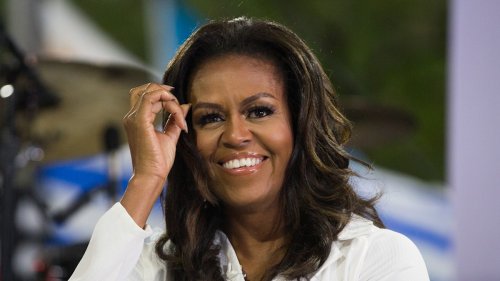 Michelle Obama wows in the boldest dress and knee-high boots for Munich dinner date