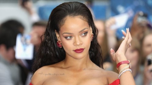 Rihanna sizzles in purple lingerie as she showcases her tattoos in intimate bedroom video