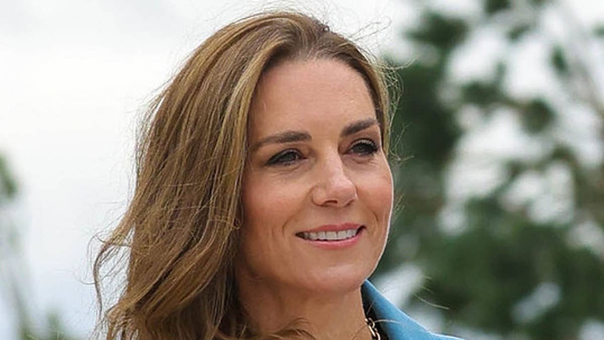 Princess Kate is poised with peplum jacket and new hairstyle as she supports Prince William on poignant outing