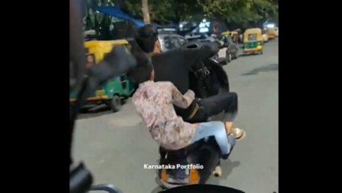 Youngsters pull off dangerous scooter stunt on road in viral video. Bengaluru Police reacts