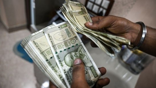 Rupee hits fresh record low of 90.42/Dollar ahead of RBI monetary policy