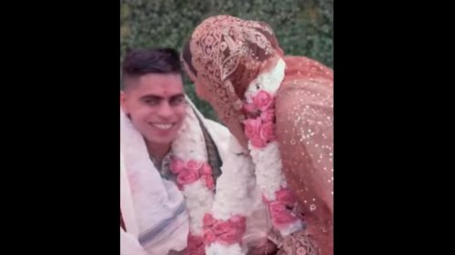 Groom touches bride's feet, Instagram simply loves the gesture. Watch