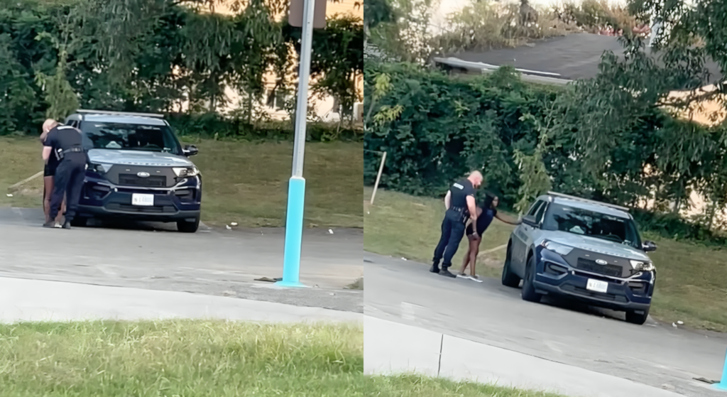 POLICE OFFICER CAUGHT KISSING RANDOM WOMAN BEFORE ‘ESCORTING’ HER INTO HIS BACK
