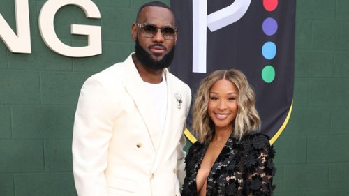 LeBron James’ Wife Savannah Stuns In Plunging Suit With No Shirt As They Cozy Up At ‘Shooting Stars’ Premiere: Photos