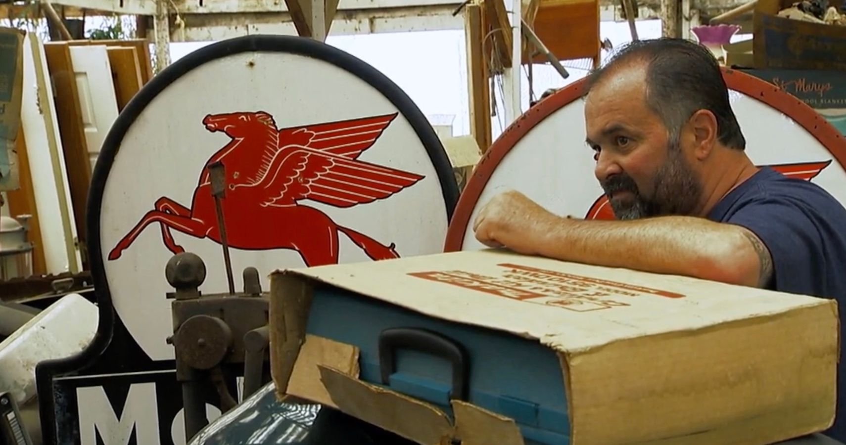 Watch American Pickers' Frank Fritz Dig Up This Rad Mobile Oil Sign