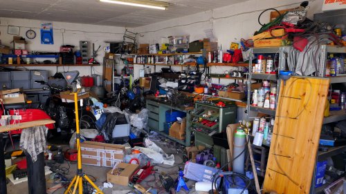 Declutter Your Garage By Tossing These 15 Commonly Stored Items