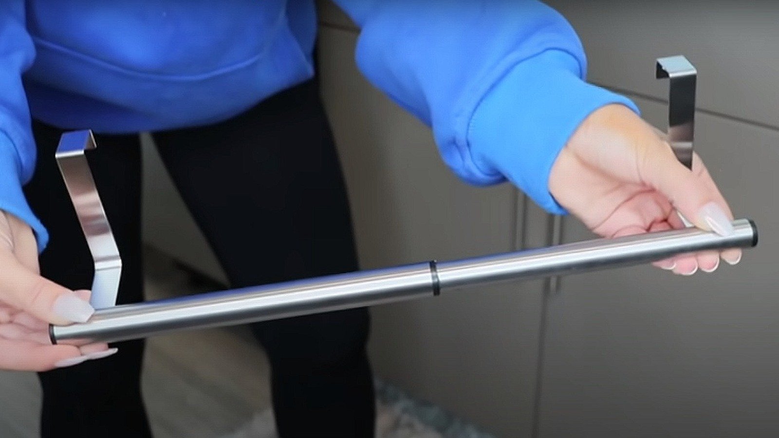 The Clever Way A Dollar Tree Towel Bar Can Add More Storage To Your Cabinets - House Digest