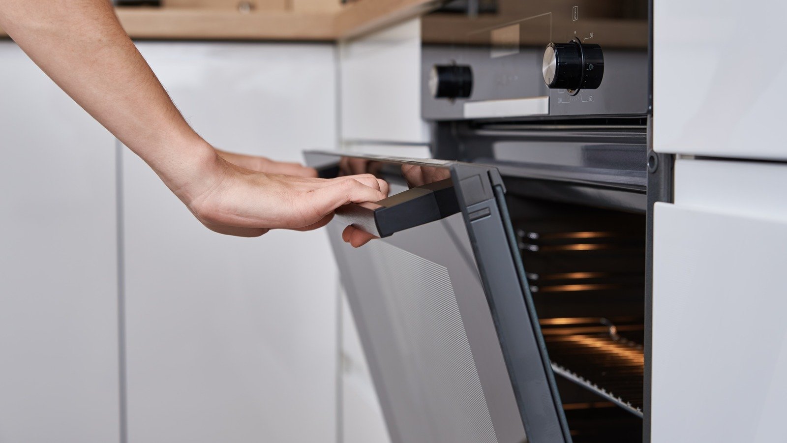 Why You Should Be Scrubbing Your Oven With A Dishwasher Tablet