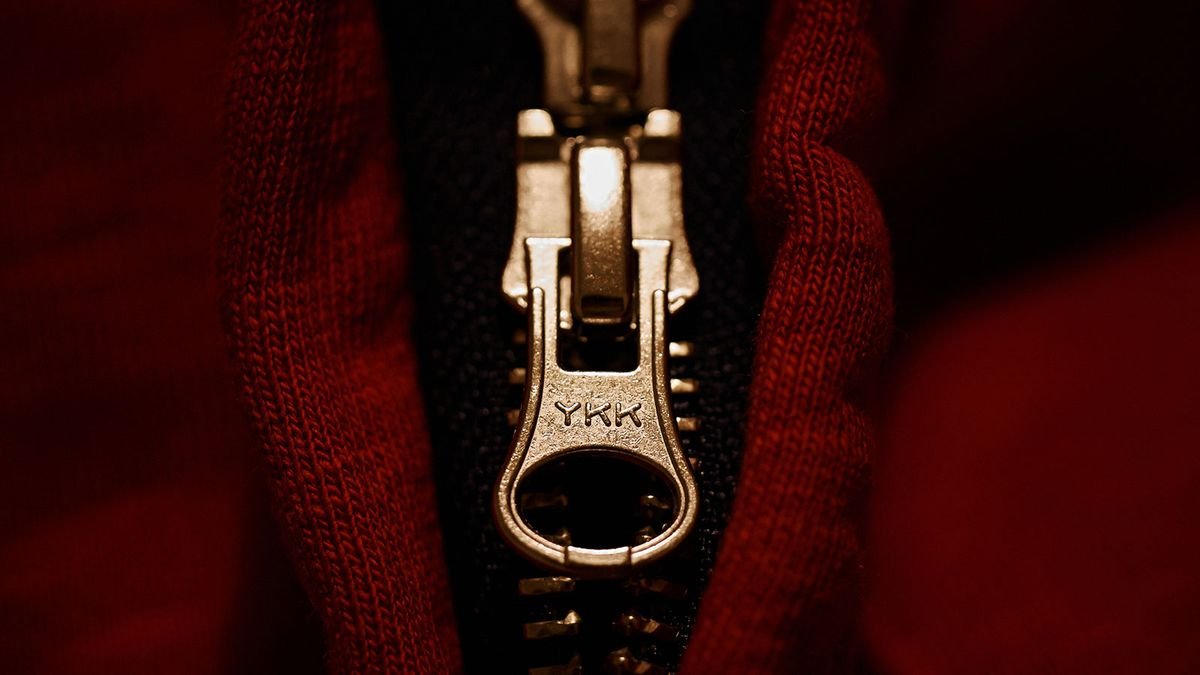 Why Do Most Zippers Say "YKK" on the Pull-Tab?