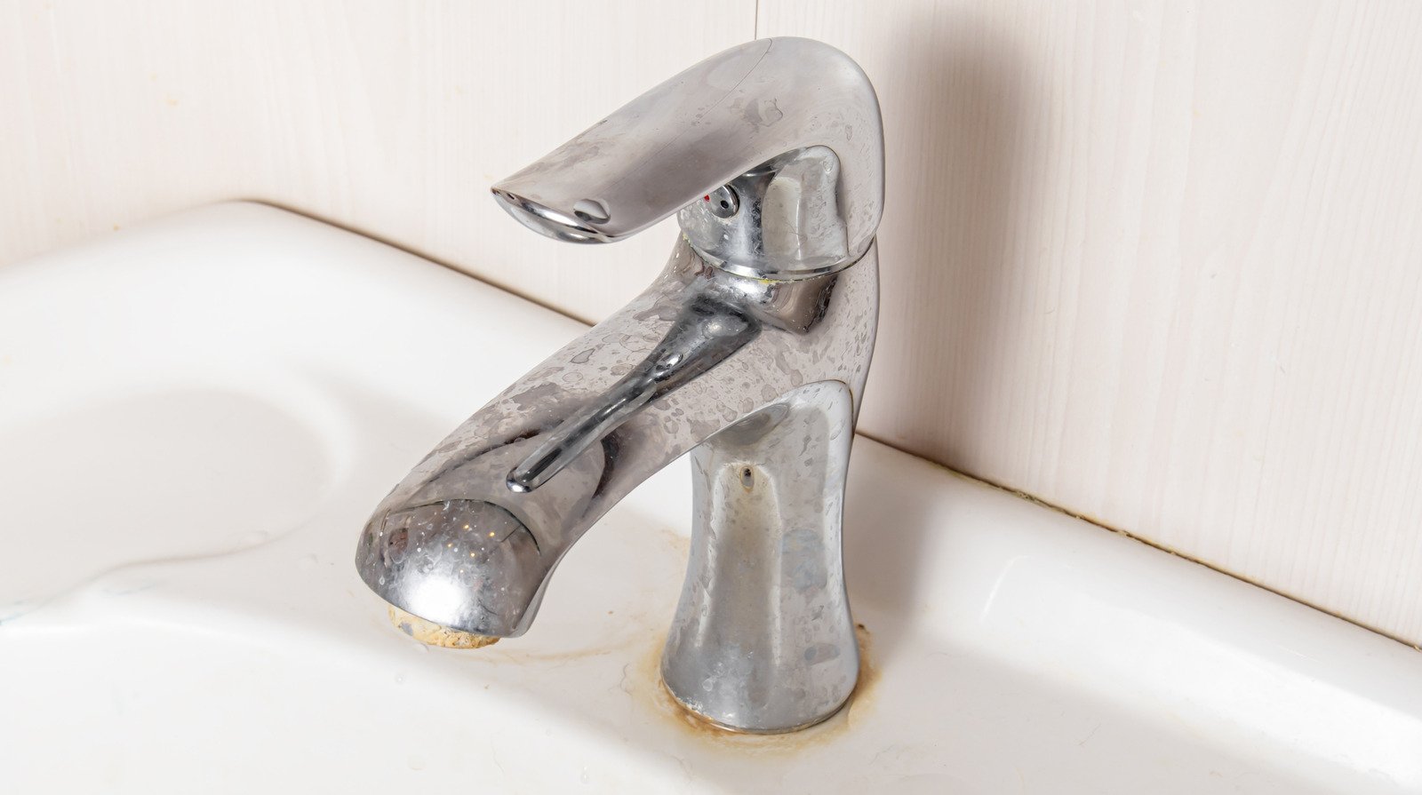Keep Hard Water Marks Off Of Your Home's Faucets With An Unexpected Candle Trick