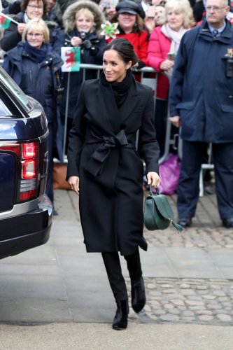Meghan Markle stuns in £1,350 Stella McCartney wrap coat upon first visit to Wales with Prince Harry
