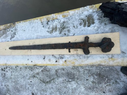 Archaeologists pick up medieval sword in ‘near-perfect’ condition from Polish river
