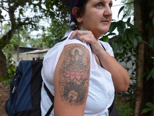 Nurse deported from Sri Lanka 'over Buddha tattoo' wins compensation | The Independent