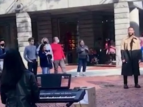 John Legend hugs and tips busker who performs his song