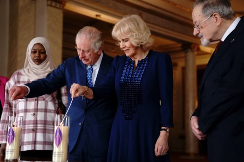 King and Queen consort light candles to remember horrors of the Holocaust