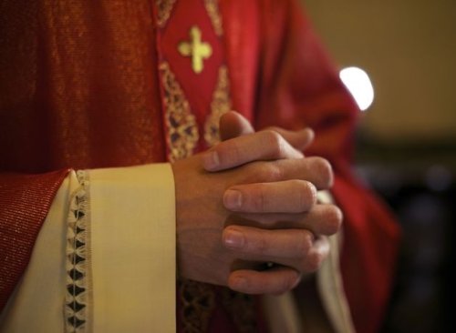 Priest arrested outside hotel after he is challenged by ‘paedophile hunters'