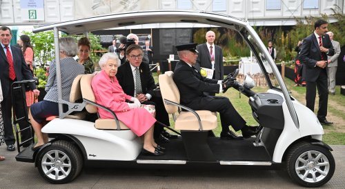 Queenmobile: The Queen uses custom electric buggy to tour Chelsea Flower Show after mobility isses