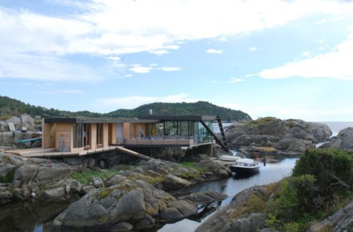 Tucked-away Norwegian island house on stilts is only accessible by boat