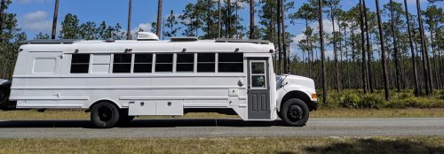 Couple converts an old school bus into a chic skoolie for travel