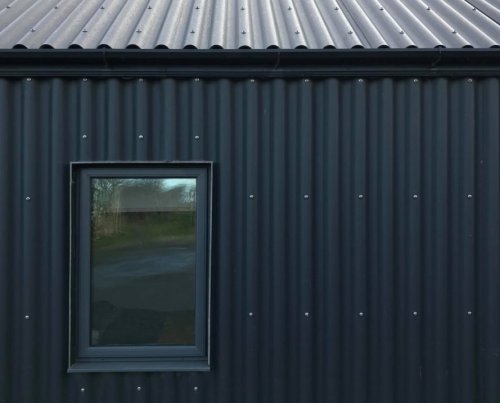 Metal-clad Eco Cottage puts a modern spin on Irish rural architecture