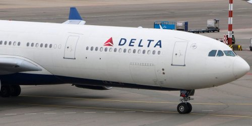 A Delta flight made an unscheduled landing after an 'unruly' passenger was reportedly restrained by other travelers