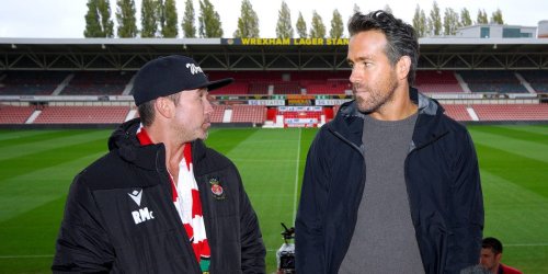The manager of Ryan Reynolds' and Rob McElhenney's Welsh soccer team says working with the Hollywood stars has been a 'whirlwind'
