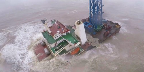 Dramatic video shows ship breaking up after being hit by a typhoon in the South China Sea, 27 crew missing