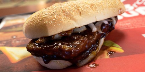 McDonald's CEO takes a "saucy" bite of the messy McRib during a video review of iconic sandwich before it leaves the menu for good