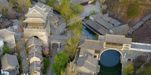 China took a rural village at the foot of the Great Wall, turned it into a replica of an ancient canal town, and now charges tourists $13 to get in — take a look