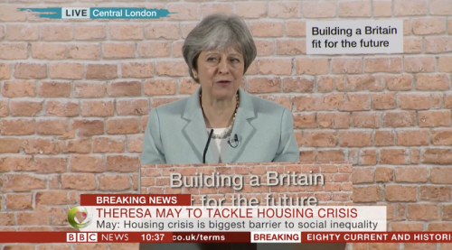 Theresa May's big housing speech was ruined by a fake brick wall