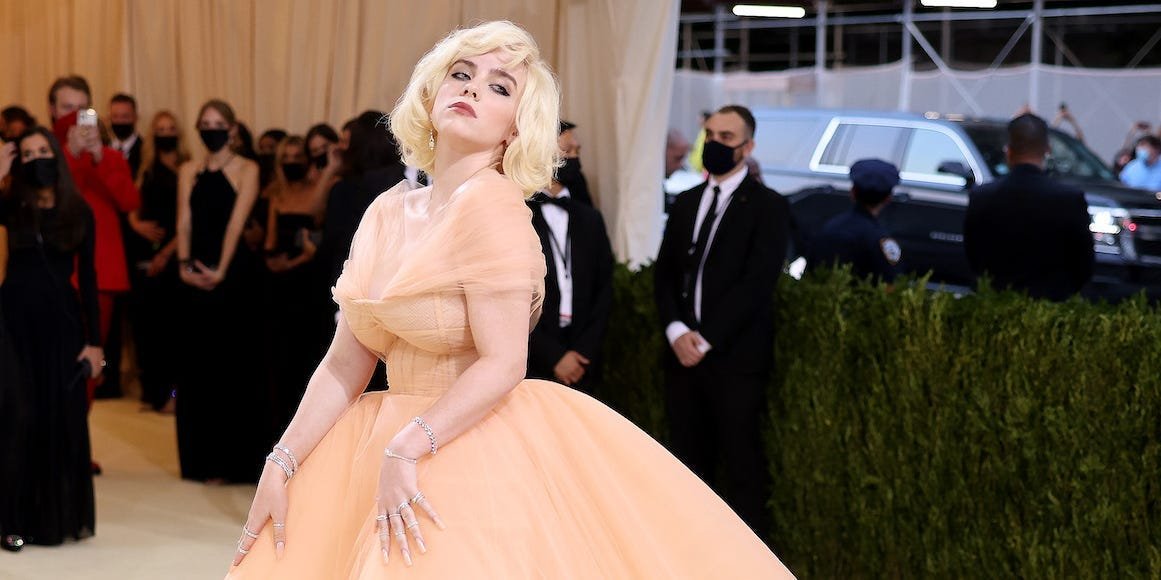 Billie Eilish channeled Marilyn Monroe at the Met Gala in a ball gown with a 15-foot train carried by 5 people
