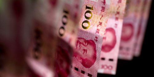 Russia is smashing open its $45 billion piggy bank of Chinese yuan as energy revenue crashes