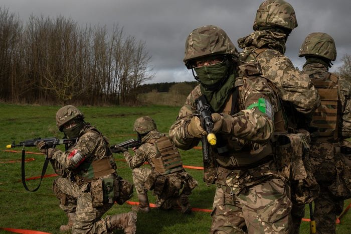 Photos show Ukrainian soldiers getting trained to fight Russians in a mock village in England