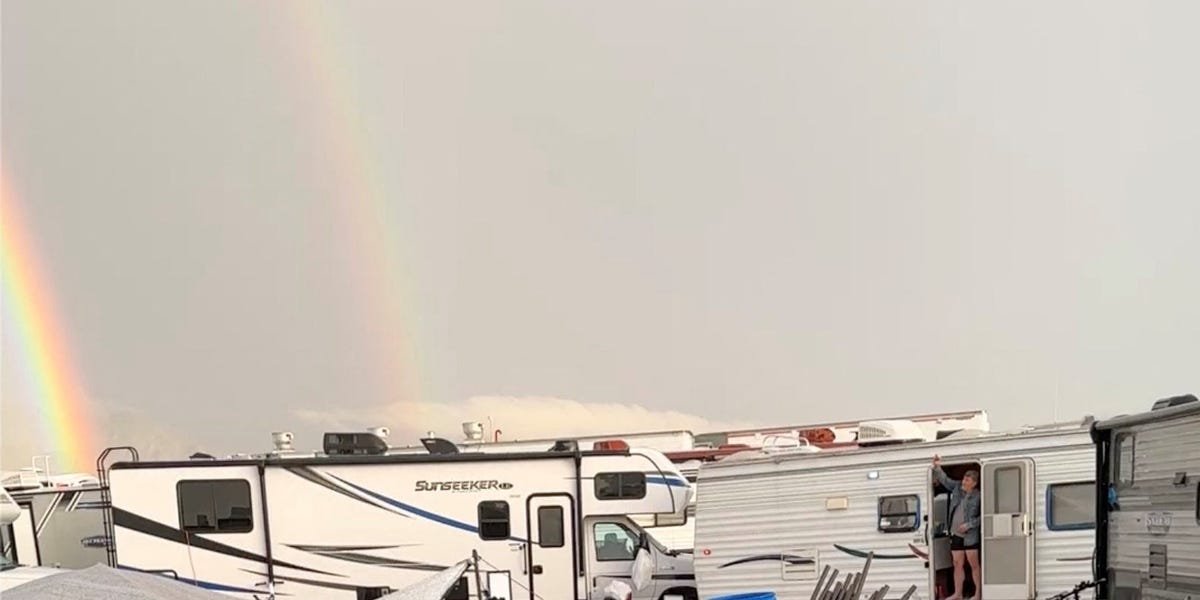 A double rainbow appeared as trapped Burning Man revelers partied in the thick mud