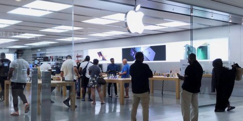US labor officials say Apple violated the law by allegedly interrogating employees and holding mandatory meetings about unionization