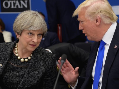 Theresa May wants Trump 'to find a way to come back' to Paris deal