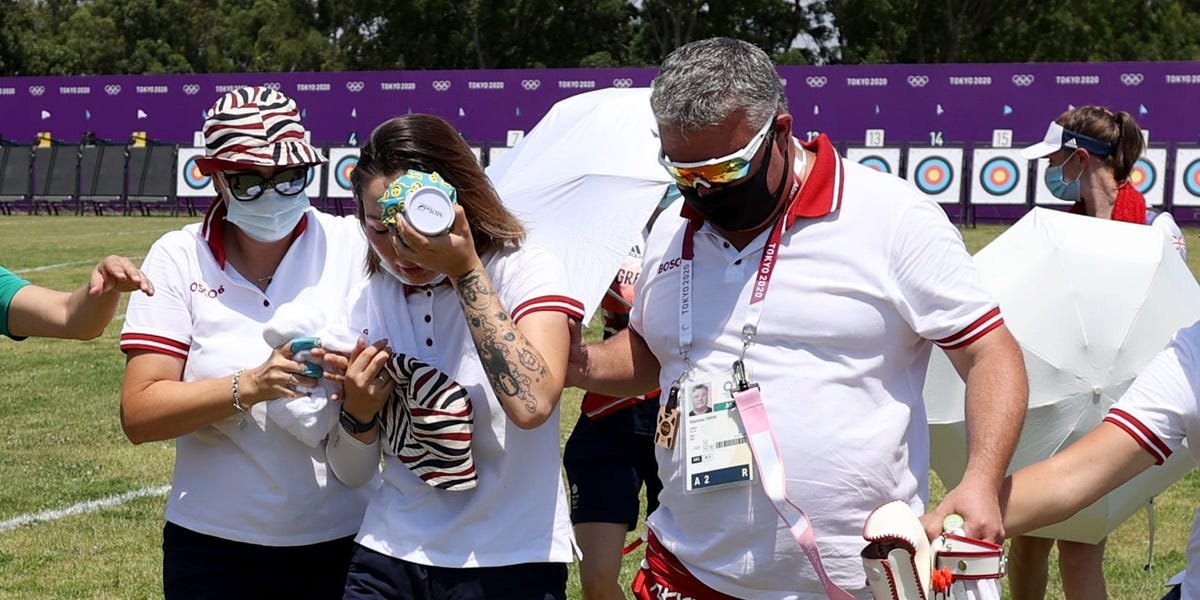 An Olympic archer collapsed and had to be helped out of the arena as sweltering temperatures hit Tokyo