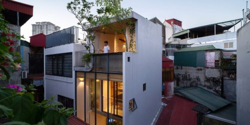 A team of architects designed a narrow, 13-foot-wide home in Hanoi that's big enough for a family of 4 and has a full-length glass wall — check it out