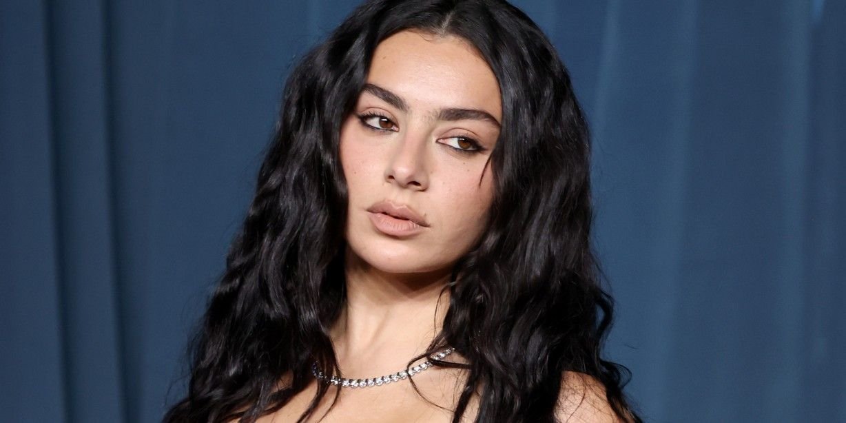 Charli XCX Stuns in Itty-Bitty Micro Shorts and Glossy, Peep-Toe Heels Paired With a $3,200 Designer Bag