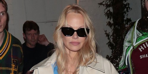 Pamela Anderson Paired Her Khaki Miniskirt With a Matching Trench Coat