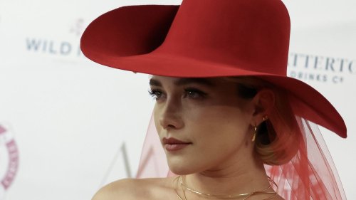 Florence Pugh Wore a High Fashion Take on the Peplum With a Red-Veiled Cowboy Hat
