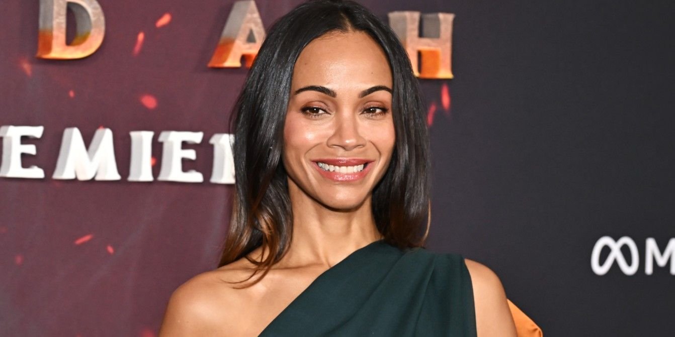 Zoe Saldaña Goes Braless in a Plunging Scoop-Neck Tank Top and High-Waisted Jeans Ahead of Her 48th Birthday
