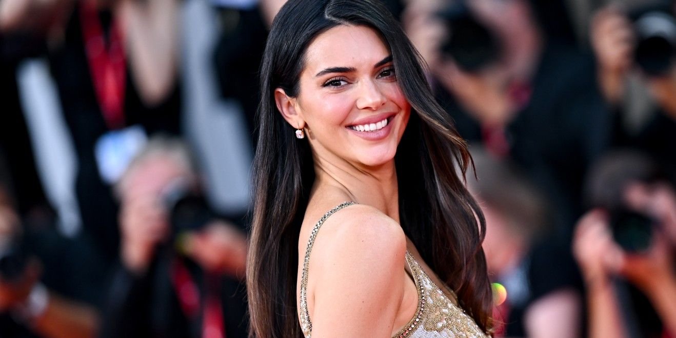 Kendall Jenner Makes Her Venice Film Festival Debut in Figure-Hugging Gold Gown Glittering With Tiny Crystals